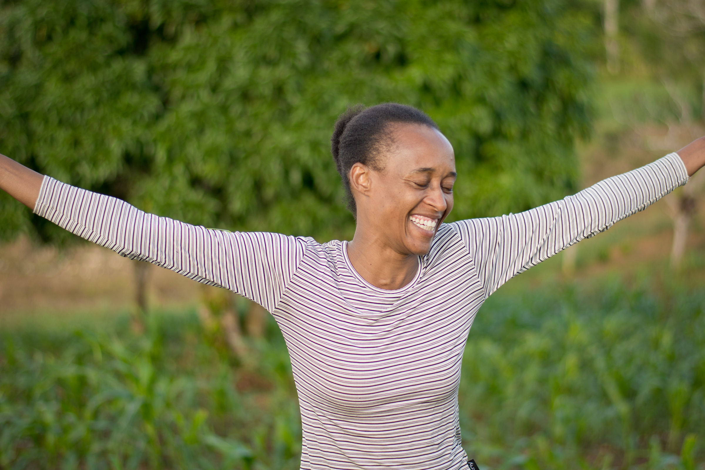 Woman with arms outstretched - full of hope