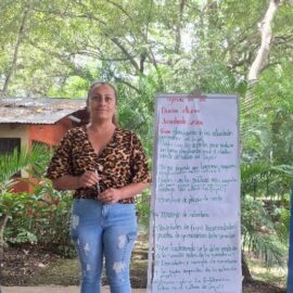 Woman Standing, leading a meeting